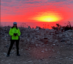 Geri standing in front of the sun rising